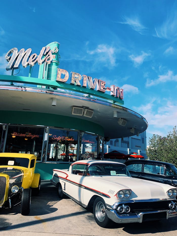 services-02 Retro cars and iconic signage at Orlando's classic diner, capturing vintage Americana vibe.