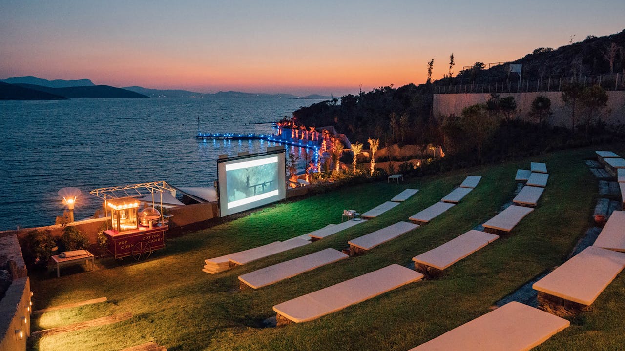 services-04 Beautiful evening outdoor movie setup by the sea in Bodrum, Turkey.